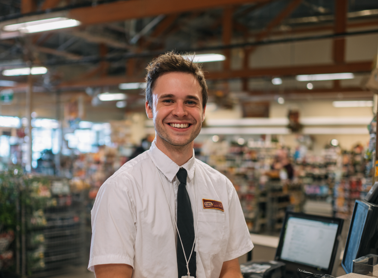 A smiling store manager | Source: Midjourney